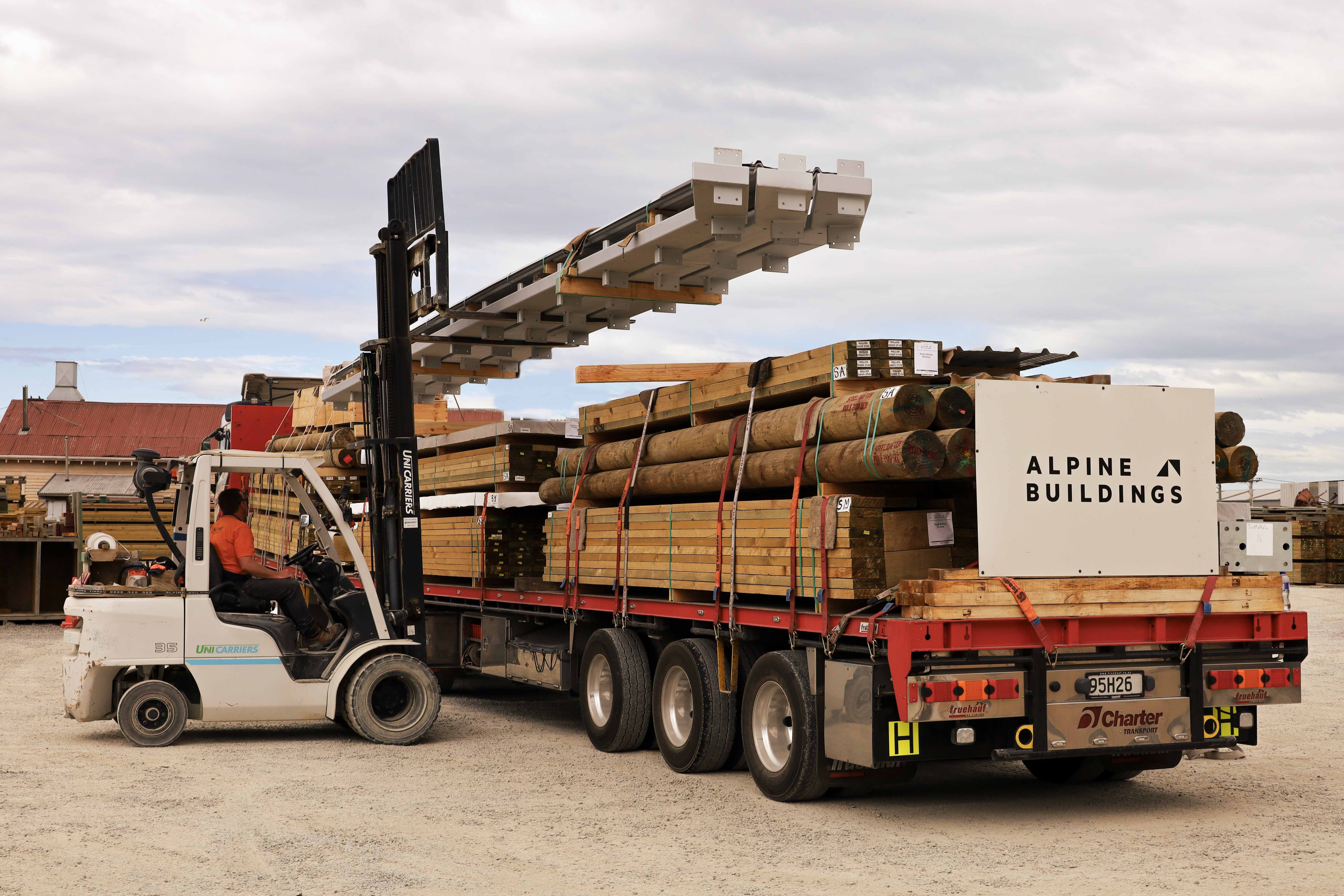 Alpine structural steel rafters being loaded onto a truck to complete the kitset shed.